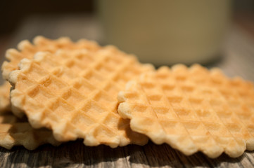 Fluted sweet biscuits and a bottle of milk