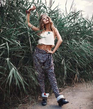 Fototapeta Outdoor hippie portrait of young beautiful woman. Boho chic styl