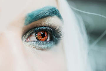 Male eye with orange lens
