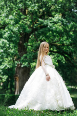 Fototapeta na wymiar small girl in white dress outdoor
