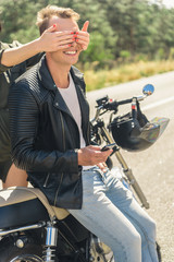 Fototapeta premium Young man sitting on his motorbike