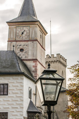 Fototapeta na wymiar street lamp in front of castle Rozmberk in Czech Republic in fal