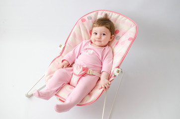 baby girl on a bouncer