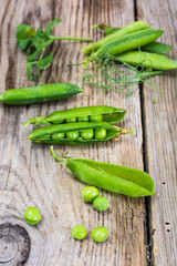 Green Peas on Wooden Rustic Background
