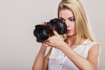 Beautiful woman with camera.