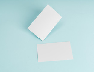 Blank business card on blue background .