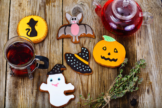 Gingerbread For Halloween With Red Tea. Funny Holiday Food