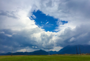 Beautiful round clouds on blue sky, in summer season