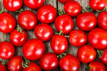Red Fresh Cherry Tomato on Wooden Rustic Background