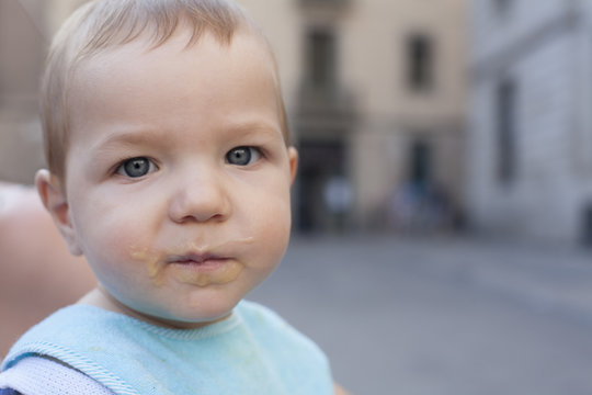 Baby Boy With Mouth Full Of Food After Having Fruit Mush