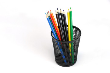 colorful pencils in the metal pen pot