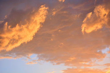 Fototapeta na wymiar Beautiful cloudscape, orange sunset clouds, natural background