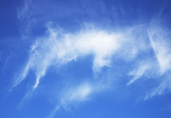 blue sky background with tiny clouds