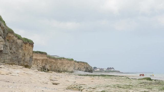 Sword beach allies landing area in WW2 northern France Normandy 4K 2160p 30 fps UltraHD tilting footage - Operation Overlord Sword beach by the day slow tilt 4K 3840X2160 UHD video 