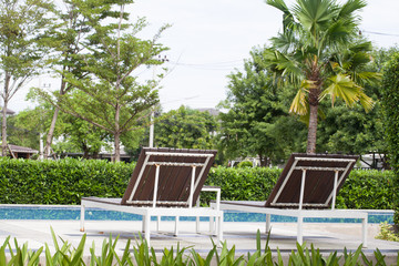 Deckchairs and swimming pool.