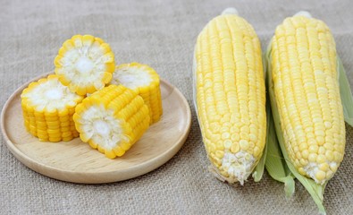 Fresh corn on wood plate