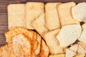 Heap of salted crisps and cookies, concept of unhealthy food