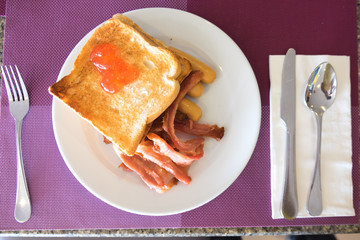 English breakfast: bacon, toast and hotdog