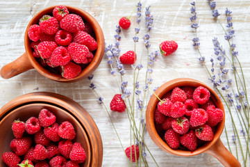 pottery with berries and lavender on wooden table