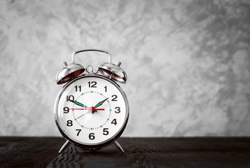 alarm clock at empty locker on white background close up