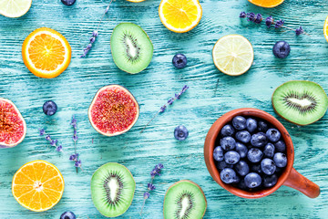 Colorful pattern made of fruits on blue textured background