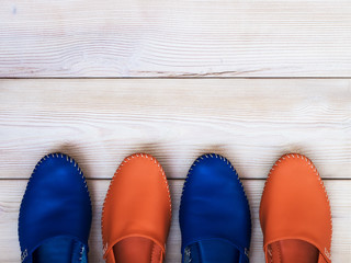Summer clothes on wooden background. View from above