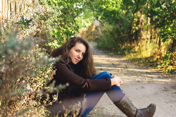 girl sitting in autumn park