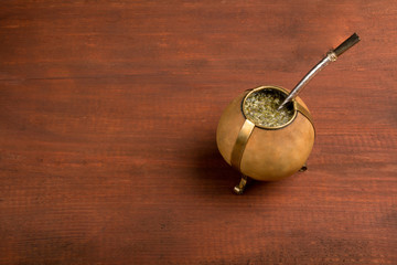 Tea mate in calabash on the table