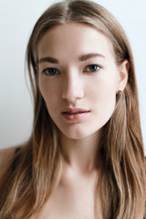 Fototapeta premium Beautiful and young girl woke up in the morning