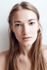 Fototapeta premium Beautiful and young girl woke up in the morning