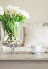 Coffee cup on table with Flowers Sofa Pillows Home decoration 