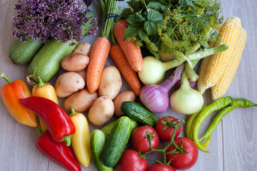 Close up of various colorful fresh raw vegetables. Flat lay. On black wooden table.