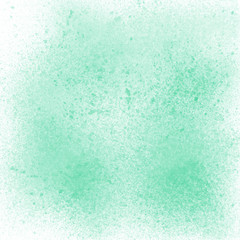 Green spray paint on white background