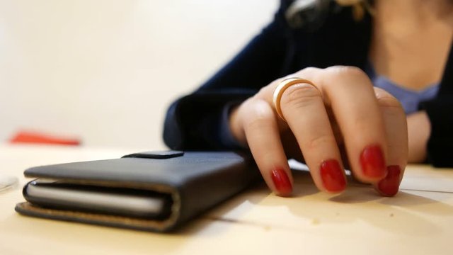 Female Hand Waiting Impatiently For Phone Call