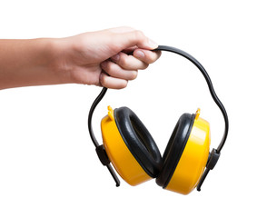 Yellow protective ear muffs in hand Isolated on a white