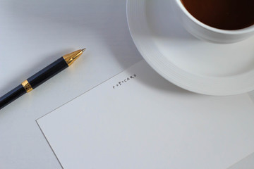 Postcards and coffee and a pen