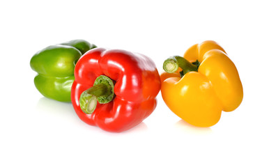 fresh green, red, yellow bell pepper with stem on white backgrou