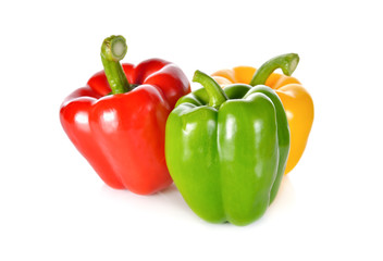Obraz na płótnie Canvas fresh green, red, yellow bell pepper with stem on white backgrou
