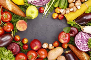 Frame of different food products on a dark surface