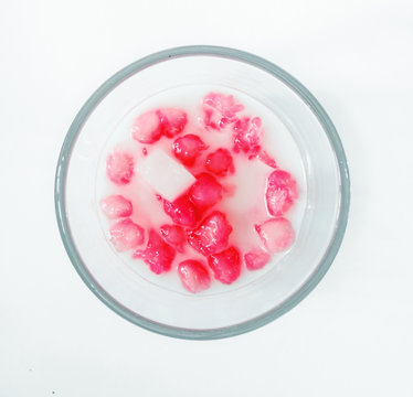 Thai dessert. Tab Tim Grob isolated on over white background. Mock Pomegranate Seeds in Coconut Syrup 