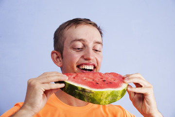young man eating watermelon