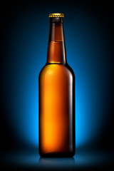 Bottle of beer or cider isolated on dark blue background