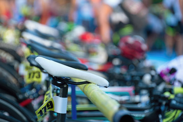 Triathlon  the transition zone.Bicycles at triathlon change over station.