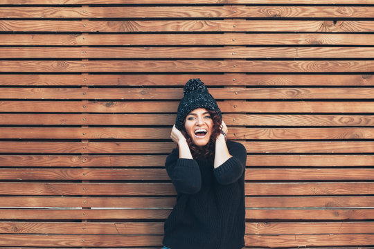 Hipster girl over wooden wall