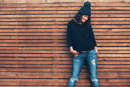 Hipster girl over wooden wall