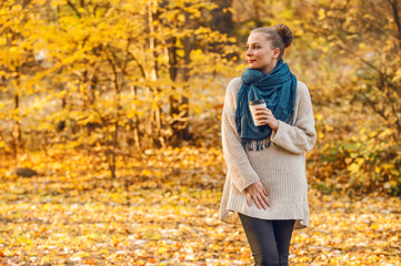 Beautiful trendy woman in autumn clothes