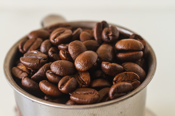 Roasted Coffee Beans / Roasted Coffee Beans In Cup Scattered Isolated On White.