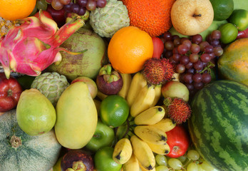Naklejka na ściany i meble Many fresh fruits mixed, fruits background