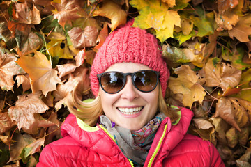 woman in autumn leaves