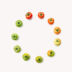 Template for your design. Composition of tomatos, arranged depending on their maturity. The concept of  organic food, healthy eating and a healthy lifestyle.